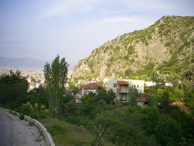 [Photo: rock tombs seen from behind the castle]